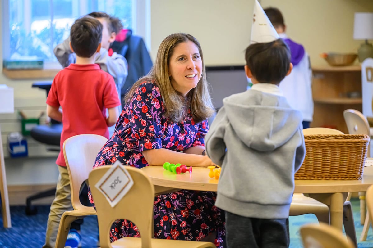 Female teacher with young students